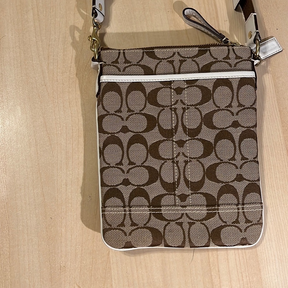Coach crossbody new without tags. Beige and brown crossbody with brown strap
